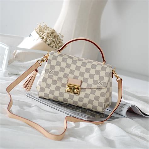 louis vuitton small white bag.